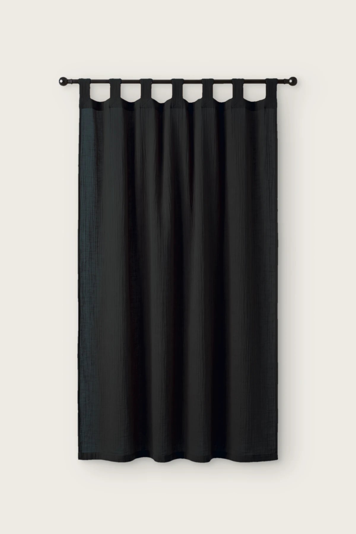 2-layer muslin cotton curtain panel in black, single tab top panel on a black rod, front view