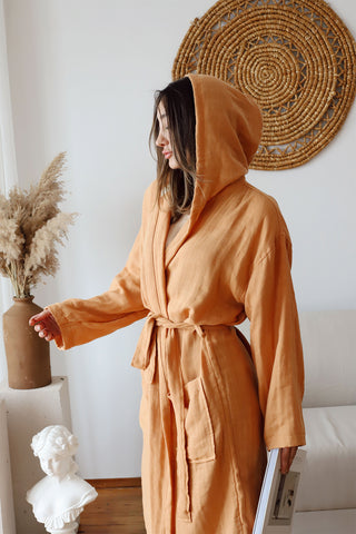 Natural hooded muslin bathrobe showing generous hood and lightweight weave by Vivamaison