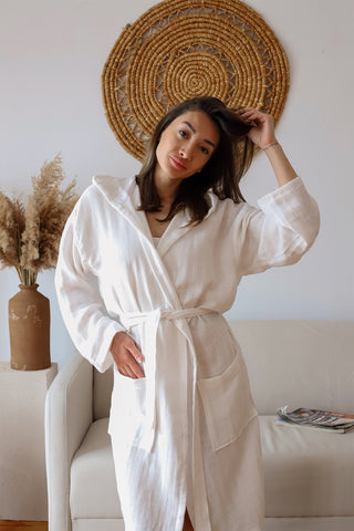 White hooded muslin bathrobe showing generous hood and lightweight weave by Vivamaison