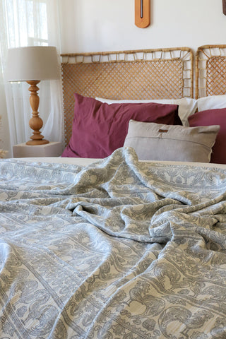 Natural patterned muslin bedspread showing woven Anatolian motifs by Vivamaison