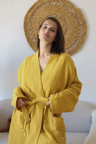 Mustard muslin bathrobe side view showing handwoven 4-layer gauze weave texture by Vivamaison
