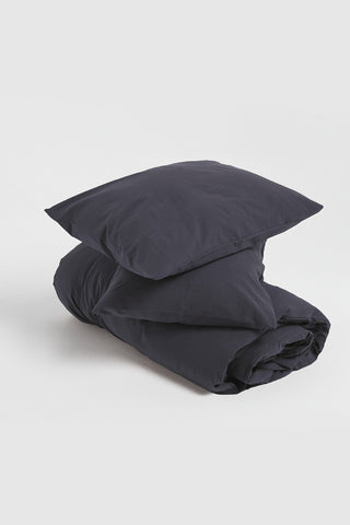 Anthracite stonewashed duvet cover styled bedroom view - breathable Aegean cotton linen