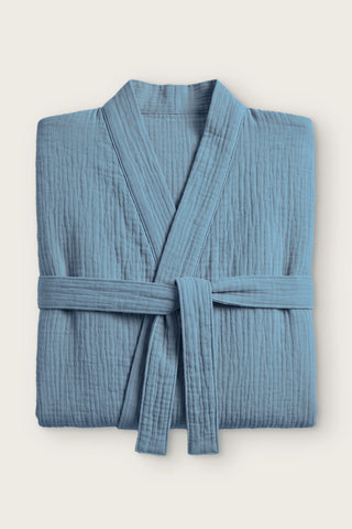 Handwoven 2-layer muslin kimono bathrobe in indigo blue, folded front view with tied belt