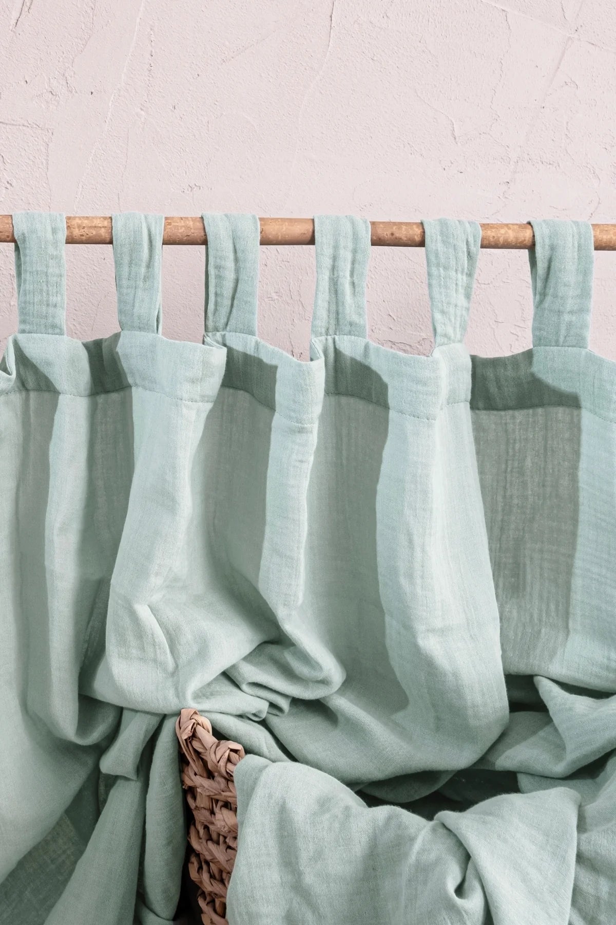 Mint tab loops close-up on bamboo rod. Handwoven 2-layer muslin cotton curtain, Denizli, OEKO-TEX. Vivamaison.
