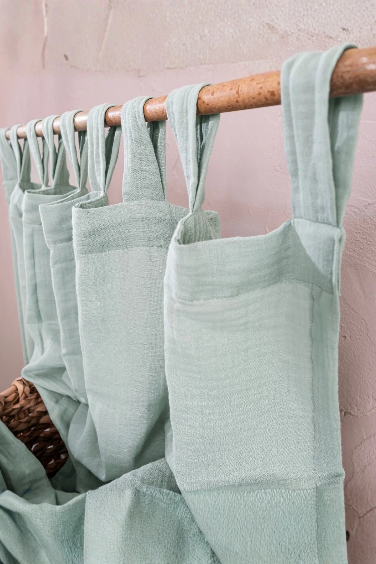 Angled close-up of mint tab top header. Handwoven 2-layer muslin cotton curtain, Denizli, OEKO-TEX. Vivamaison.