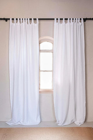 White tab top pair, black rod, arched window. Handwoven 2-layer muslin cotton curtain, Denizli, OEKO-TEX. Vivamaison.