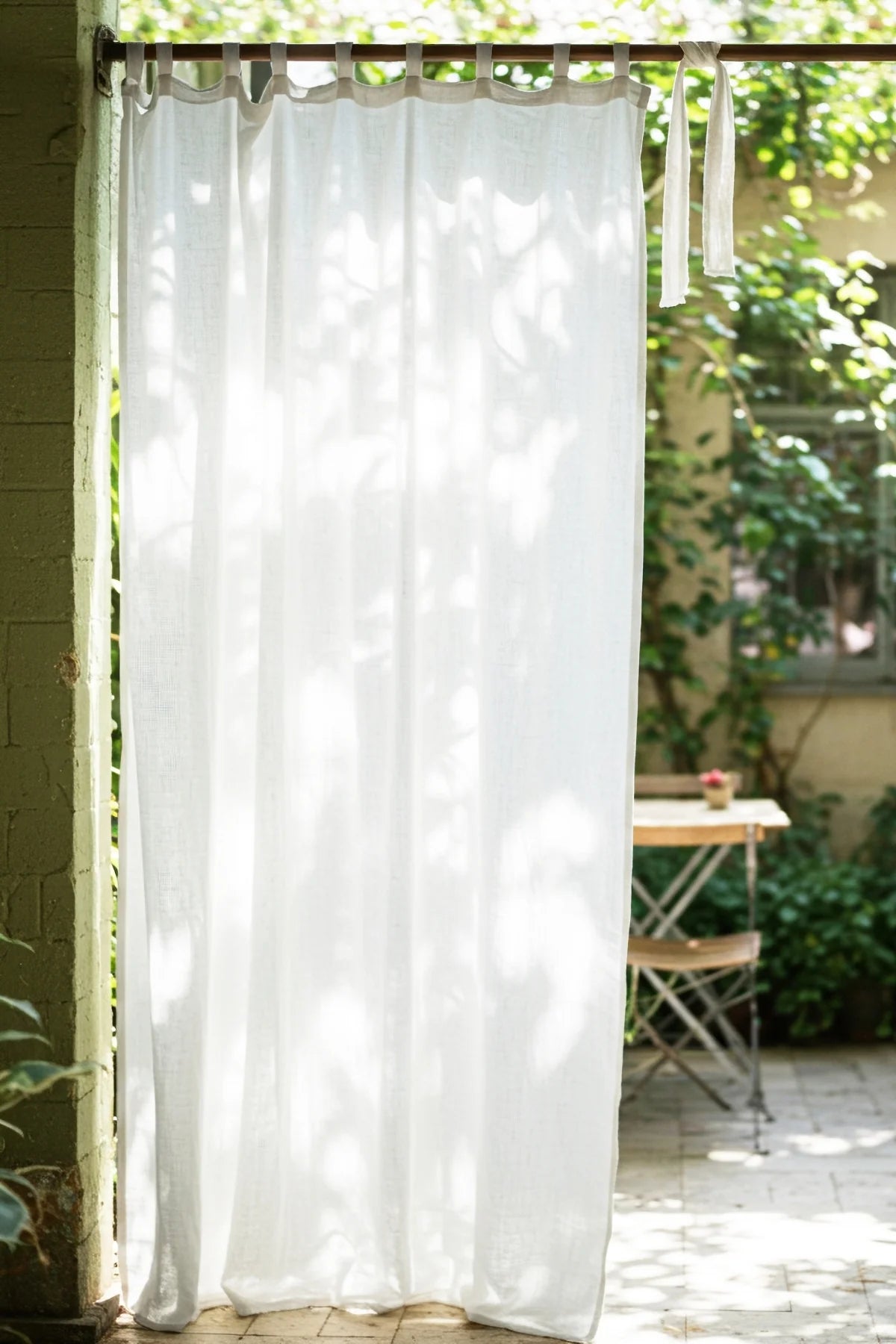 White tab top panel, garden patio backdrop. Handwoven 2-layer muslin cotton curtain, Denizli, OEKO-TEX. Vivamaison.