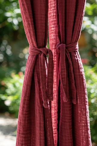 Curtain panels cinched with matching tieback knots. Handwoven 2-layer muslin cotton curtain, Denizli, OEKO-TEX. Vivamaison.