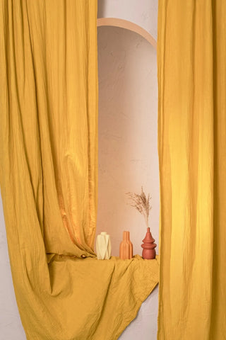 Mustard panels framing niche with ceramic vases. Handwoven 2-layer muslin cotton curtain, Denizli, OEKO-TEX. Vivamaison.