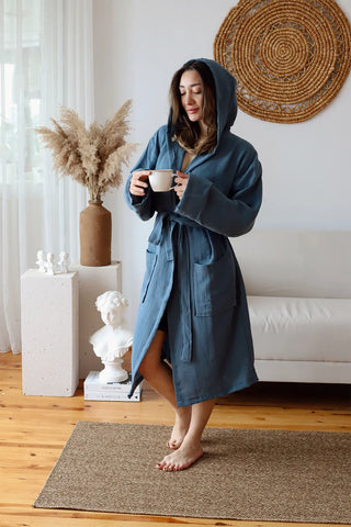 Indigo blue 2-layer muslin hooded bathrobe hood up front lifestyle. Handwoven Turkish cotton Denizli, OEKO-TEX. Vivamaison.