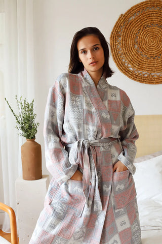 Christmas patterned muslin bathrobe front full lifestyle. Handwoven Turkish cotton Denizli, OEKO-TEX. Vivamaison.