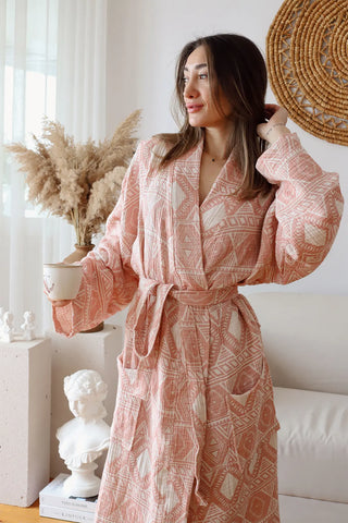 Ethnic pink patterned muslin bathrobe front closeup lifestyle. Handwoven Turkish cotton Denizli, OEKO-TEX. Vivamaison.