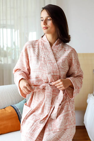 Indian patterned muslin bathrobe front closeup seated. Handwoven Turkish cotton Denizli, OEKO-TEX. Vivamaison.