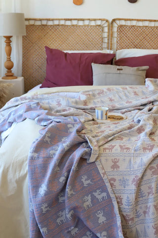 Deer handwoven 3-layer patterned muslin Turkish cotton bedspread folded flat lay. Woven patterns, Denizli, OEKO-TEX. Vivamais