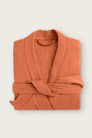 Handwoven 4-layer muslin kimono bathrobe in terracotta, folded front view with wrapped belt
