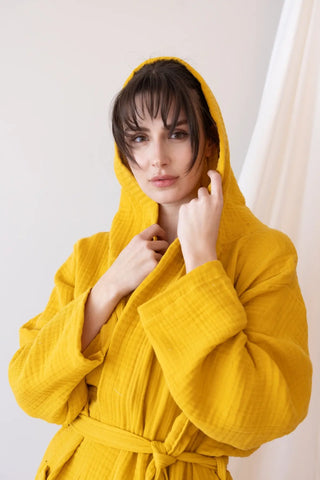 Mustard handwoven 4-layer muslin hooded Turkish cotton bathrobe hood close up. Denizli, OEKO-TEX. Vivamaison.