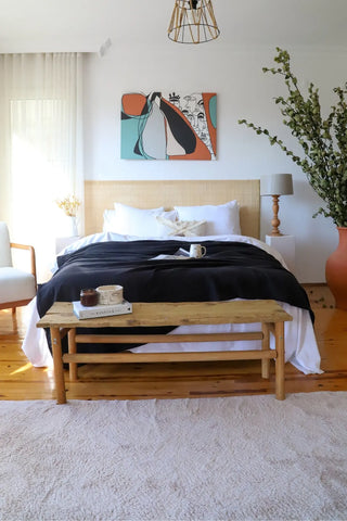 Black handwoven 4-layer muslin Turkish cotton bedspread folded flat lay. Long-staple Denizli, OEKO-TEX. Vivamaison.