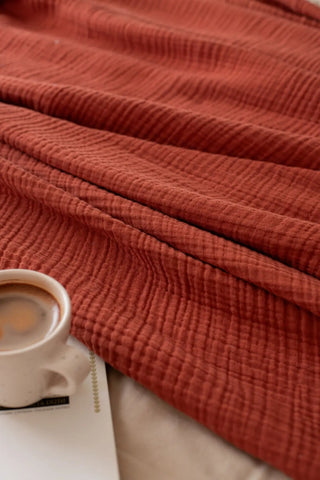 Burgundy handwoven 4-layer muslin Turkish cotton bedspread lifestyle. Long-staple Denizli, OEKO-TEX. Vivamaison.