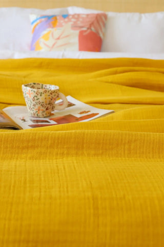 Mustard handwoven 4-layer muslin Turkish cotton bedspread alternate view. Long-staple Denizli, OEKO-TEX. Vivamaison.