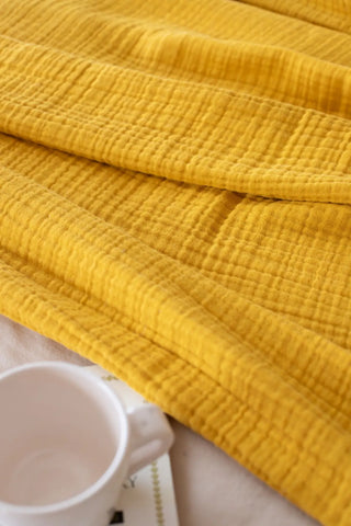Mustard handwoven 4-layer muslin Turkish cotton bedspread draped bed. Long-staple Denizli, OEKO-TEX. Vivamaison.