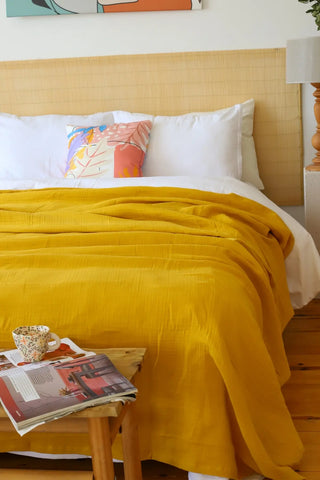 Mustard handwoven 4-layer muslin Turkish cotton bedspread styled bedroom. Long-staple Denizli, OEKO-TEX. Vivamaison.
