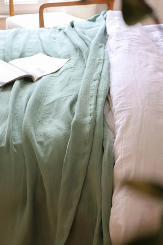 Sage Green handwoven 4-layer muslin Turkish cotton bedspread draped bed. Long-staple Denizli, OEKO-TEX. Vivamaison.
