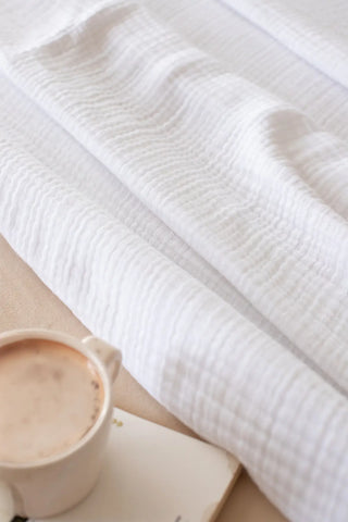 White handwoven 4-layer muslin Turkish cotton bedspread draped bed. Long-staple Denizli, OEKO-TEX. Vivamaison.