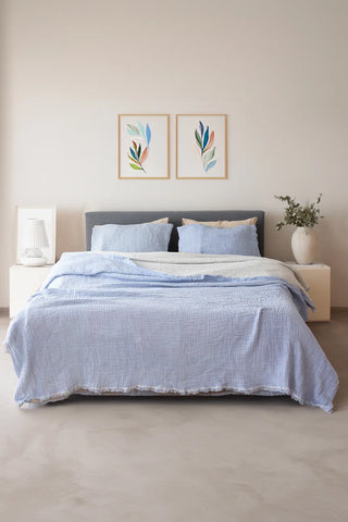 Baby Blue handwoven 4-layer soft muslin fringed bedspread draped bed. Tasseled edges, Denizli, OEKO-TEX. Vivamaison.
