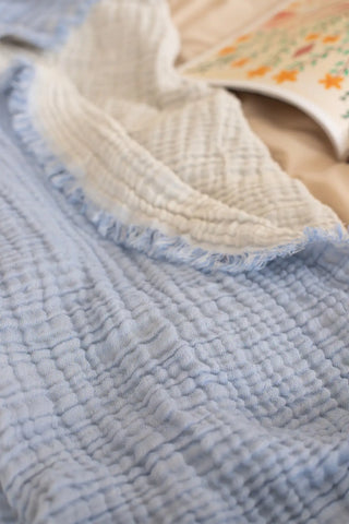 Baby Blue handwoven 4-layer soft muslin fringed bedspread edge detail. Tasseled edges, Denizli, OEKO-TEX. Vivamaison.