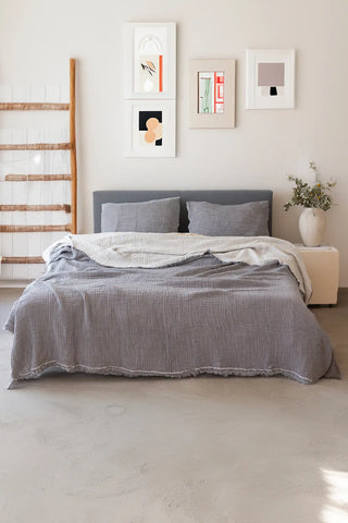 Grey handwoven 4-layer soft muslin fringed bedspread draped bed. Tasseled edges, Denizli, OEKO-TEX. Vivamaison.
