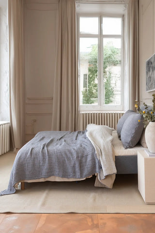 Grey handwoven 4-layer soft muslin fringed bedspread lifestyle. Tasseled edges, Denizli, OEKO-TEX. Vivamaison.