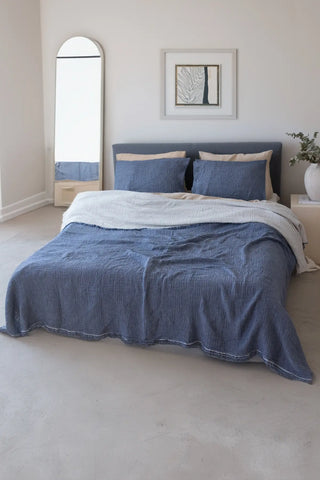 Indigo Blue handwoven 4-layer soft muslin fringed bedspread lifestyle. Tasseled edges, Denizli, OEKO-TEX. Vivamaison.