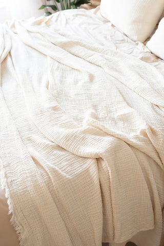 Natural handwoven 4-layer soft muslin fringed bedspread fringe close up. Tasseled edges, Denizli, OEKO-TEX. Vivamaison.
