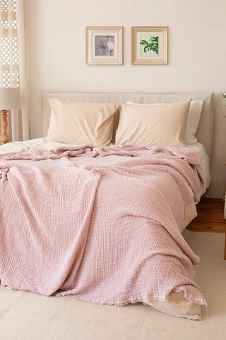 Pink handwoven 4-layer soft muslin fringed bedspread styled bedroom. Tasseled edges, Denizli, OEKO-TEX. Vivamaison.