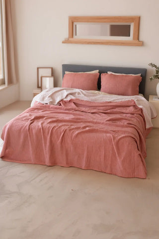 Terracotta handwoven 4-layer soft muslin fringed bedspread lifestyle. Tasseled edges, Denizli, OEKO-TEX. Vivamaison.