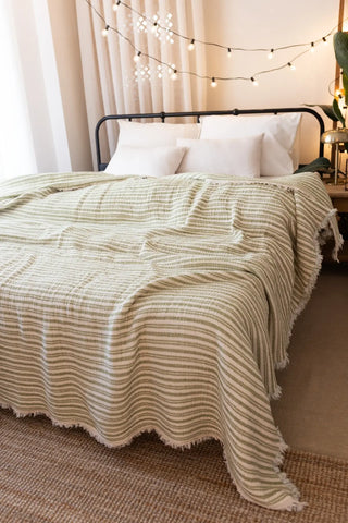 Green Striped handwoven 8-layer muslin Turkish cotton quilt bedroom lifestyle. Hand-tied fringe Denizli, OEKO-TEX. Vivamaison