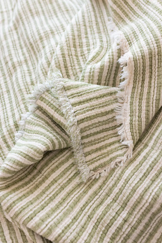 Green Striped handwoven 8-layer muslin Turkish cotton quilt detail. Hand-tied fringe Denizli, OEKO-TEX. Vivamaison.