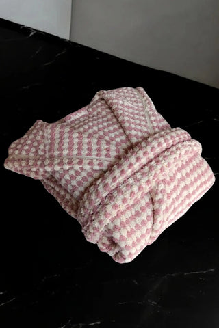 Light pink chickpea bathrobe folded flat lay. Handwoven Turkish cotton Denizli, OEKO-TEX. Vivamaison.