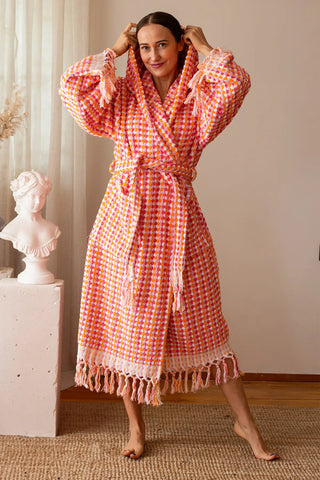 Handwoven chickpea pattern bathrobe in pink orange, hood up front. Turkish cotton Denizli, OEKO-TEX. Vivamaison.