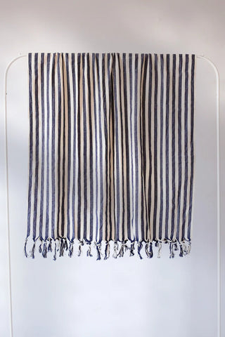 Navy blue classic striped peshtemal towel hanging full view. Handwoven Turkish cotton Denizli, OEKO-TEX. Vivamaison.