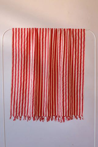 Red classic striped peshtemal towel hanging full view. Handwoven Turkish cotton Denizli, OEKO-TEX. Vivamaison.