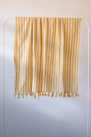Yellow classic striped peshtemal towel hanging full view. Handwoven Turkish cotton Denizli, OEKO-TEX. Vivamaison.