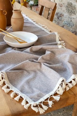 Brown handwoven Turkish cotton tassel table runner overhead. Hand-tied tassels Denizli, OEKO-TEX. Vivamaison.