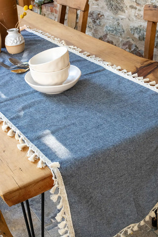 Navy Blue handwoven Turkish cotton tassel table runner folded flat lay. Hand-tied tassels Denizli, OEKO-TEX. Vivamaison.