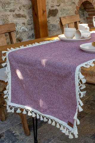 Plum handwoven Turkish cotton tassel table runner folded flat lay. Hand-tied tassels Denizli, OEKO-TEX. Vivamaison.