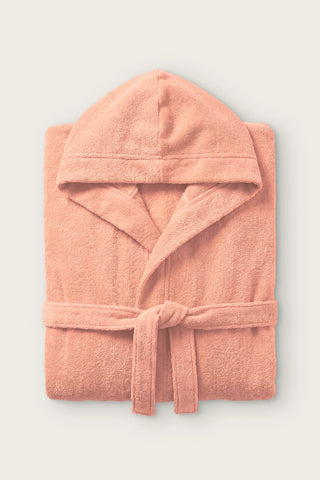 Handwoven Turkish cotton terry hooded bathrobe in salmon, folded front view with hood and tied belt