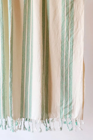 Green elegant striped peshtemal towel fringe detail closeup. Handwoven Turkish cotton Denizli, OEKO-TEX. Vivamaison.