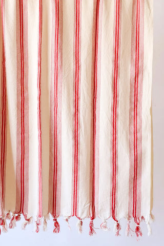 Red elegant striped peshtemal towel fringe detail closeup. Handwoven Turkish cotton Denizli, OEKO-TEX. Vivamaison.