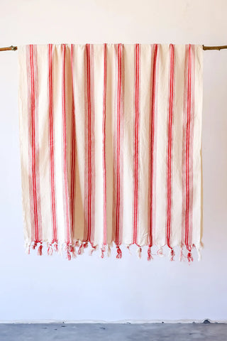 Red elegant striped peshtemal towel hanging full view. Handwoven Turkish cotton Denizli, OEKO-TEX. Vivamaison.