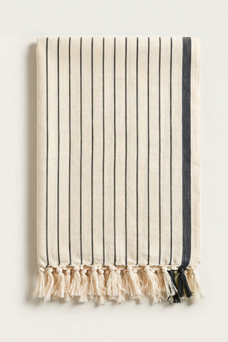 Luxury striped Turkish cotton peshtemal towel in black, folded front view with side band and knotted fringe
